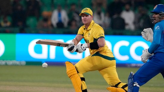 Australia's Steve Smith, center, plays a shot during the ICC Champions Trophy cricket match between Australia and Afghanistan, in Lahore, Pakistan, Friday, Feb. 28, 2025. (AP Photo/K.M. Chaudary)