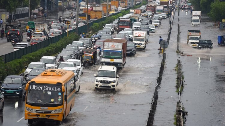 Gurugram, India-June 17, 2025: Vehicles wade through a waterlogged stretch after heavy rain on the National Highway-48 service road near Narsinghpur village, in Gurugram, India, on Tuesday, 17 June 2025. (Photo by Parveen Kumar/Hindustan Times)